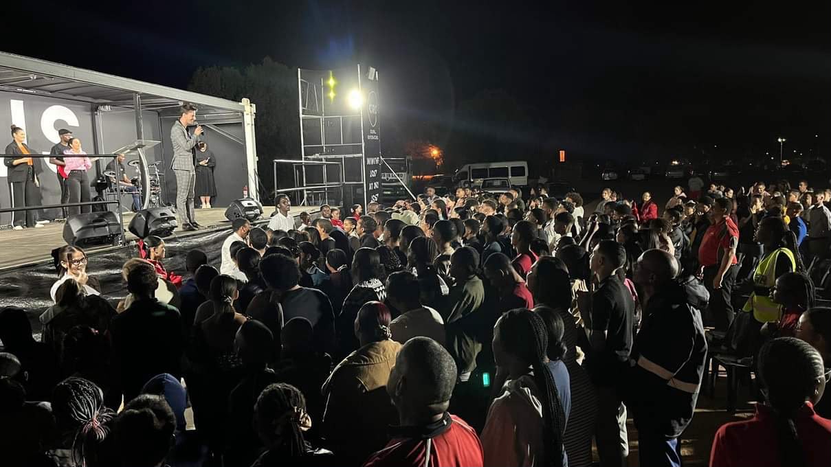 People gathered near the stage during an altar call