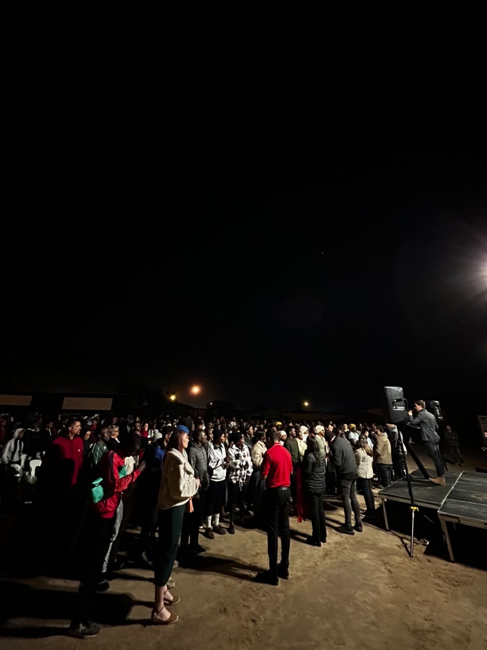 Armin preaching to people gathered at an altar call in Walvis Bay, Namibia